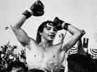 Ray "Boom Boom" Mancini celebrates his victory after his 14th-round knockout of challenger Duk Koo Kim in Las Vegas on Nov. 13, 1982.
