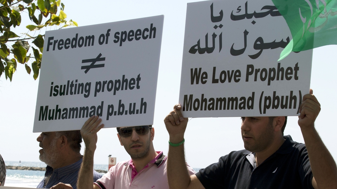 Arab-Israeli men protest a video mocking the Prophet Muhammad, in front of the U.S. Embassy in Tel Aviv, Israel, on Thursday.