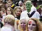 Need to lighten up your day? Invite some of these folks. (A "zombie walk" in Stockholm on Aug. 25.)