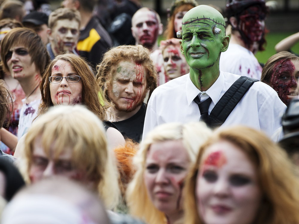 Need to lighten up your day? Invite some of these folks. (A "zombie walk" in Stockholm on Aug. 25.)