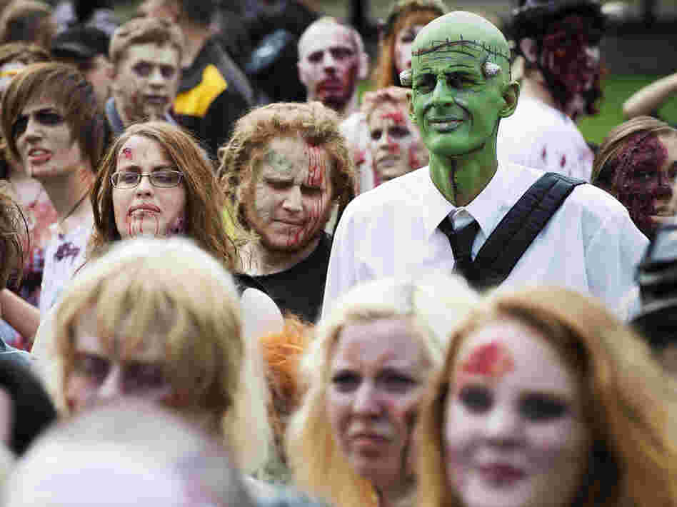 Need to lighten up your day? Invite some of these folks. (A "zombie walk" in Stockholm on Aug. 25.)