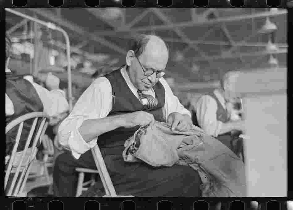 Barry Leving worked as a tailor in the cooperative garment factory in Jersey Homesteads. This town was one of 99 towns set up by the National Industrial Recovery Act in the midst of the economic crisis in the 1930s, and was later renamed Roosevelt, after the president who set up these 'New Deal' towns. The photographs in this slideshow were taken in the early days of the town.