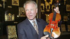 Con man/violin dealer Dietmar Machold holds a (purported) Strad in Moscow in 2003. Con man/violin dealer Dietmar Machold holds a (purported) Strad in Moscow in 2003.