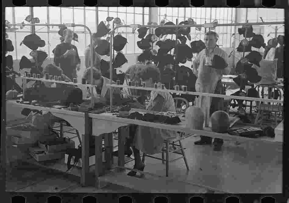 Women at work in the millinery department of the cooperative garment factory.