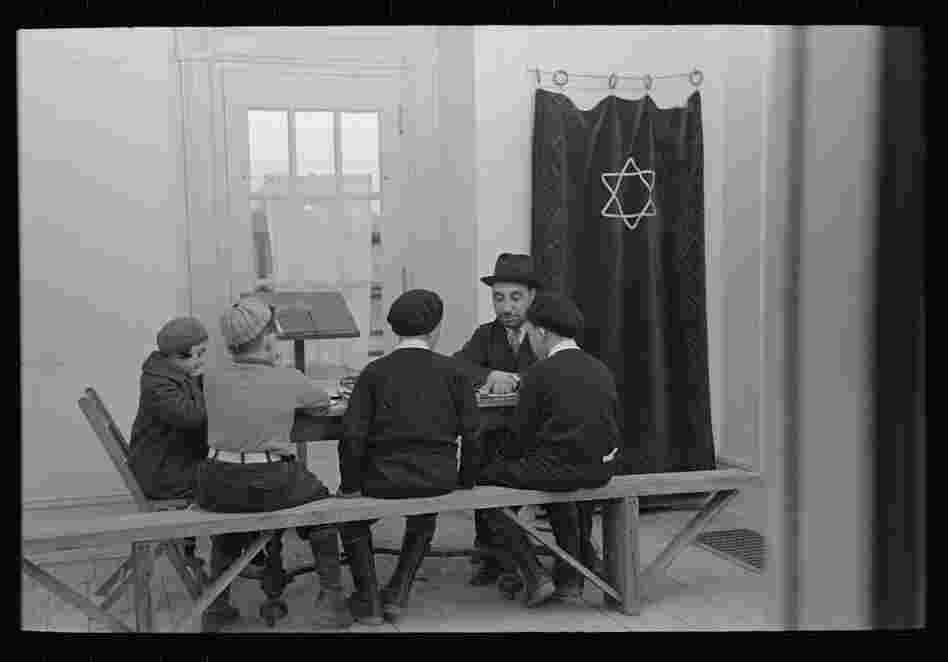 A visiting rabbi teaches children.  The majority of Jersey Homesteads came from the Bronx's Jewish community.
