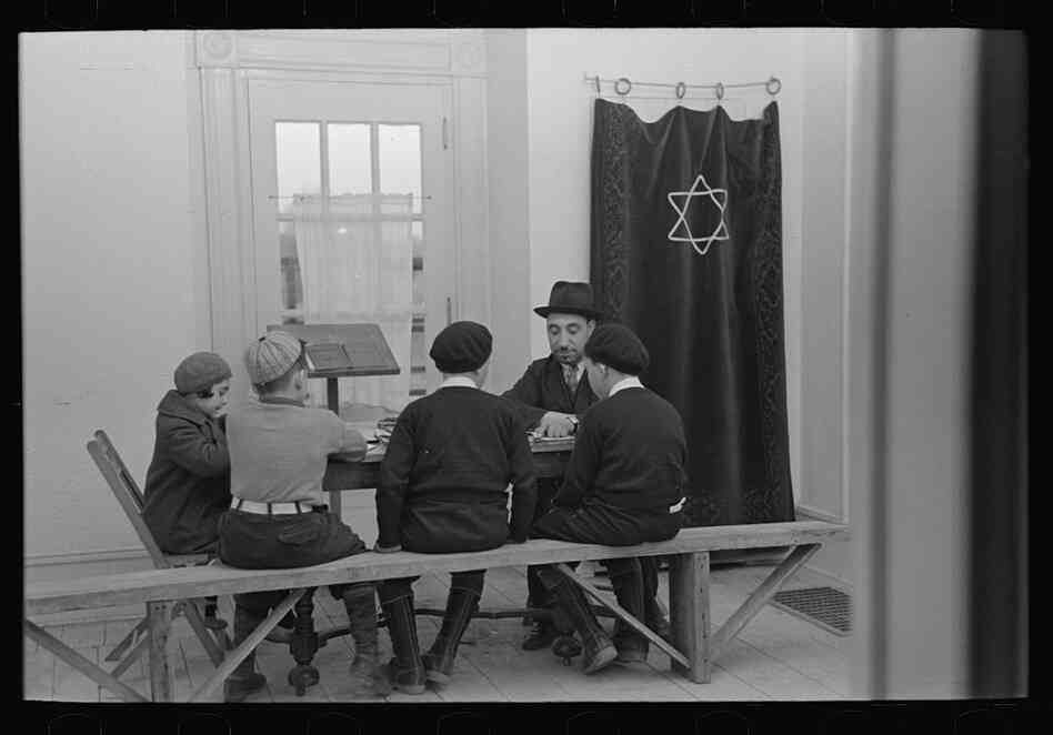 A visiting rabbi teaches children.  The majority of Jersey Homesteads came from the Bronx's Jewish community.