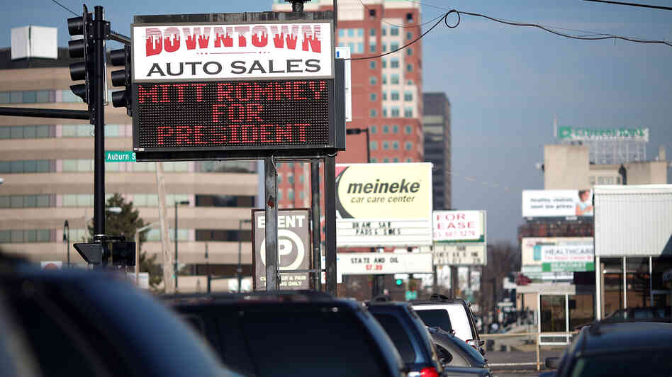 A used-car lot displays a sign in support of Republican presidential candidate Mitt Romney in Manchester, N.H., in January.