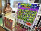 Booths that sell paper pull-tab games like this one have new competition in Minnesota: electronic pull-tab games played on iPads. The games are meant to help pay for a new football stadium in Minneapolis.