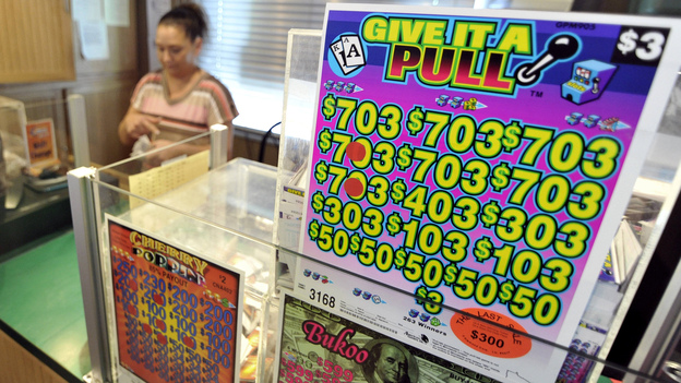 Booths that sell paper pull-tab games like this one have new competition in Minnesota: electronic pull-tab games played on iPads. The games are meant to help pay for a new football stadium in Minneapolis.