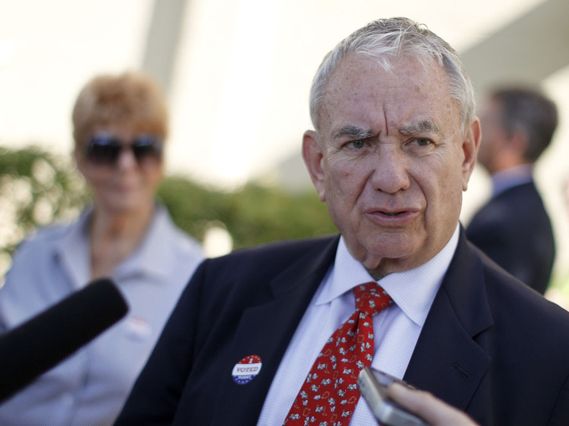 Wisconsin Senate candidate Tommy Thompson, a Republican, talks to the media after voting in the primary election on Aug. 14 in Madison.