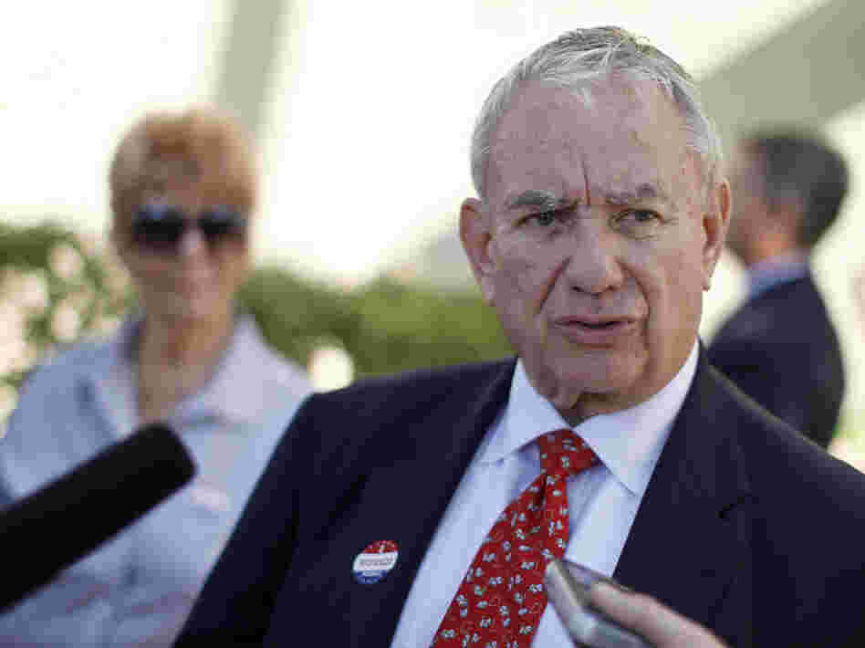 Wisconsin Senate candidate Tommy Thompson, a Republican, talks to the media after voting in the primary election on Aug. 14 in Madison.