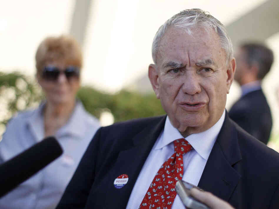 Wisconsin Senate candidate Tommy Thompson, a Republican, talks to the media after voting in the primary election on Aug. 14 in Madison.