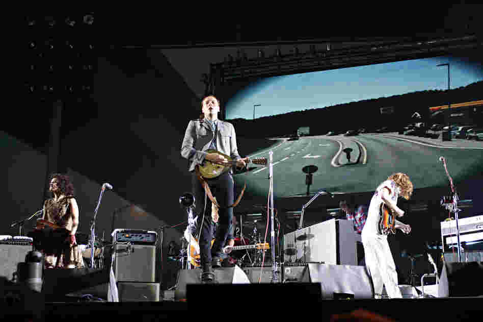 Though the Canadian band Arcade Fire is led by singer Win Butler on most songs, the group has cultivated a communal image. 