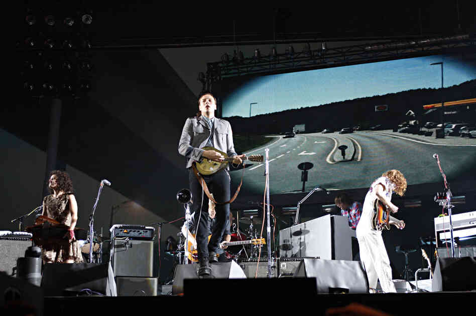 Though the Canadian band Arcade Fire is led by singer Win Butler on most songs, the group has cultivated a communal image. 