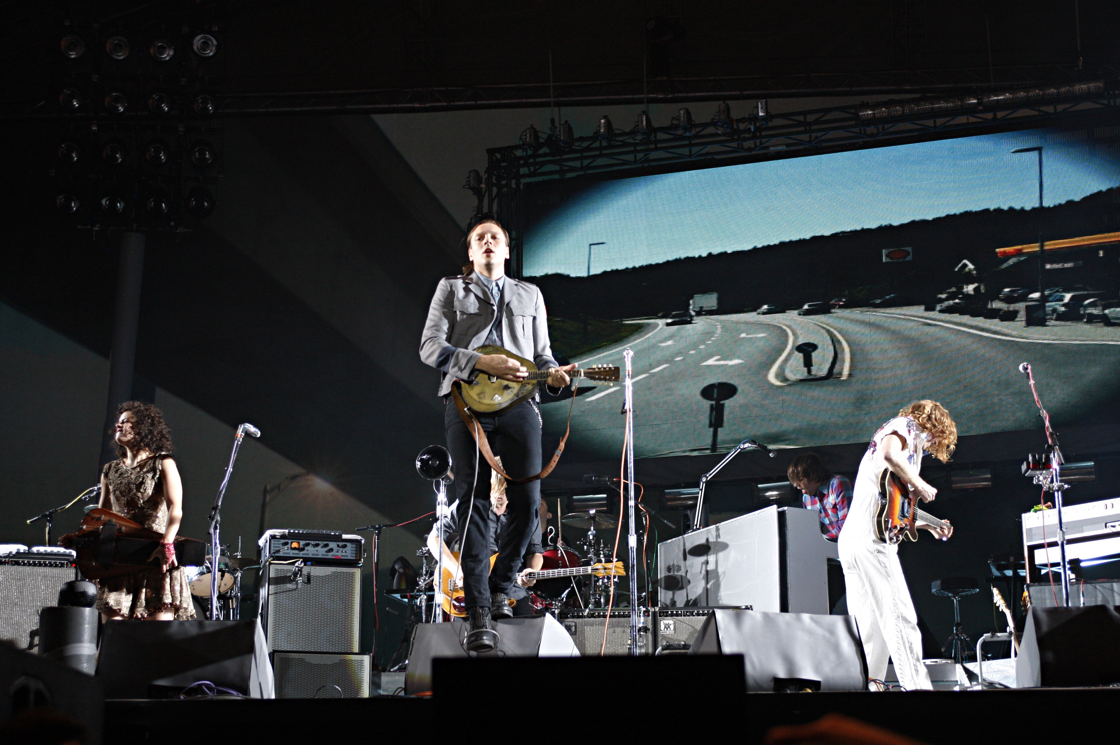 Though the Canadian band Arcade Fire is led by singer Win Butler on most songs, the group has cultivated a communal image. 