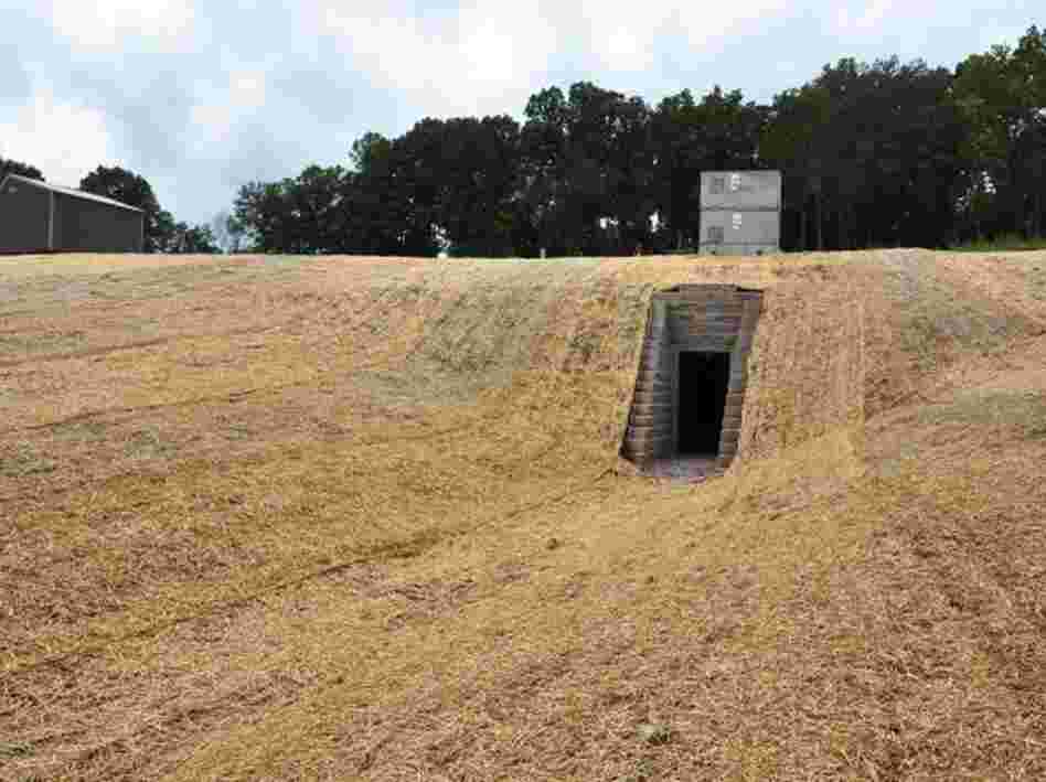 The artificial cave built for bats in Tennessee has a human entrance below and a bat entrance above. In the summer, any fungus left by the bats over the winter will be cleaned up.
