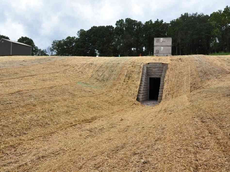 The artificial cave built for bats in Tennessee has a human entrance below and a bat entrance above. In the summer, any fungus left by the bats over the winter will be cleaned up.