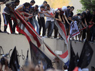 Egyptians destroy an American flag pulled down from the U.S. Embassy in Cairo, Sept. 11, during a protest over the film that insulted the Prophet Muhammad. Egyptians destroy an American flag pulled down from the U.S. Embassy in Cairo, Sept. 11, during a protest over the film that insulted the Prophet Muhammad.