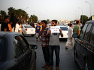 A Libyan follower of Ansar al-Sharia Brigades carries a placard reads in Arabic "our Islamic holies are red line," during a protest in front of the Tibesti Hotel, in Benghazi, Libya, on Sept. 14, as part of widespread anger across the Muslim world about a film ridiculing Islam's Prophet Muhammad. A Libyan follower of Ansar al-Sharia Brigades carries a placard reads in Arabic "our Islamic holies are red line," during a protest in front of the Tibesti Hotel, in Benghazi, Libya, on Sept. 14, as part of widespread anger across the Muslim world about a film ridiculing Islam's Prophet Muhammad.