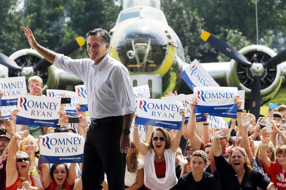 Mitt Romney takes the stage at a campaign rally at the Military Aviation Museum in Virginia Beach, Va., on Sept. 8.