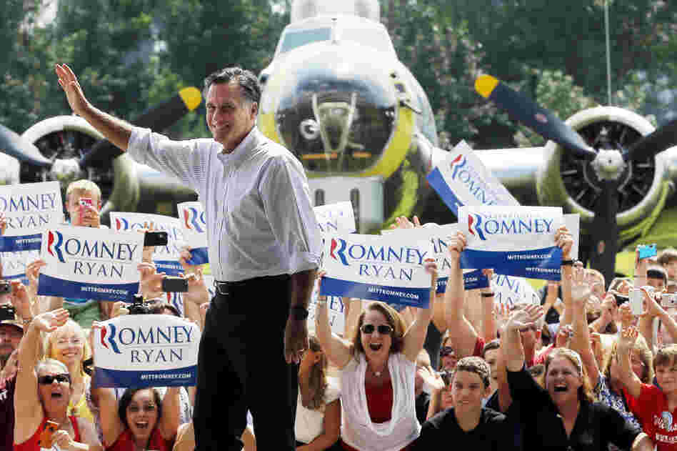 Mitt Romney takes the stage at a campaign rally at the Military Aviation Museum in Virginia Beach, Va., on Sept. 8.