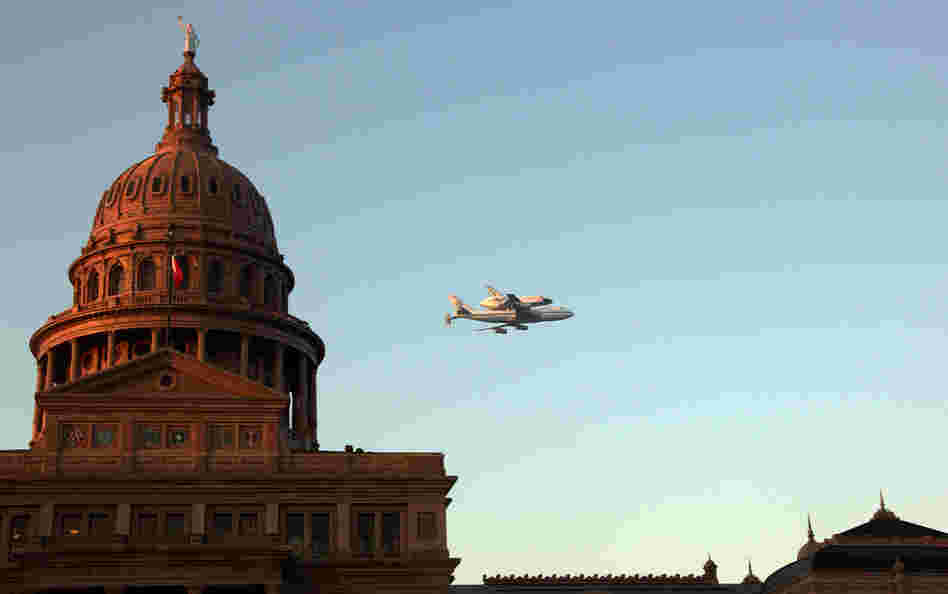 Space Shuttle Endeavour sits atop the shuttle aircraft carrier, flies over downtown Austin, Texas early Thursday. Space Shuttle Endeavour sits atop the shuttle aircraft carrier, flies over downtown Austin, Texas early Thursday.