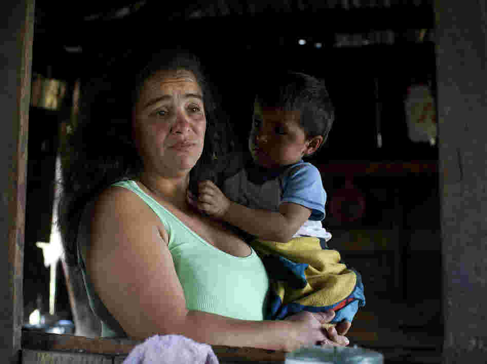 Nohemi Caicedo holds her grandson, Christian Camilo, in the kitchen of her home in Marquetalia, the birthplace of the FARC, in Colombia's Tolima state. Her 18-year-old son was killed in the insurgency after he was forcibly recruited to the FARC. She wants to give peace a chance, for the sake of her other children.