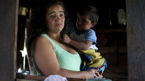 Nohemi Caicedo holds her grandson, Christian Camilo, in the kitchen of her home in Marquetalia, the birthplace of the FARC, in Colombia's Tolima state. Her 18-year-old son was killed in the insurgency after he was forcibly recruited to the FARC. She wants to give peace a chance, for the sake of her other children.