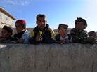 January 2011: Boys in the Andar district of Afghanistan gathered to collect candy from passing U.S. Army soldiers. Now, there are reports from that area of locals rising up against the Taliban. January 2011: Boys in the Andar district of Afghanistan gathered to collect candy from passing U.S. Army soldiers. Now, there are reports from that area of locals rising up against the Taliban.