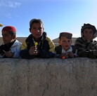 January 2011: Boys in the Andar district of Afghanistan gathered to collect candy from passing U.S. Army soldiers. Now, there are reports from that area of locals rising up against the Taliban.