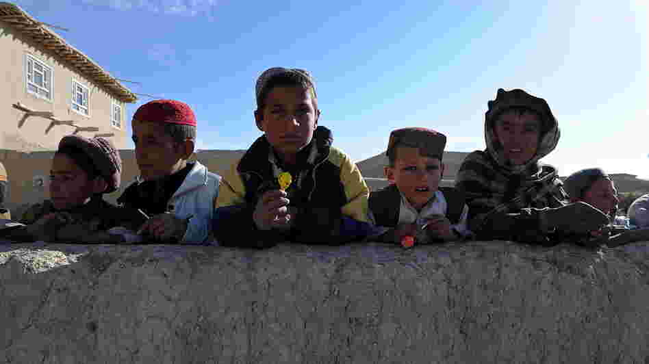 January 2011: Boys in the Andar district of Afghanistan gathered to collect candy from passing U.S. Army soldiers. Now, there are reports from that area of locals rising up against the Taliban.