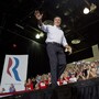 Mitt Romney waves to supporters as he arrives at a rally Friday in Las Vegas.