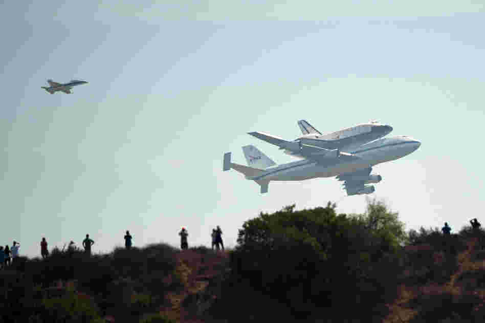 The space shuttle Endeavor flies by Griffith Observatory on its final voyage to the California Science Center in Los Angeles, Calif., Friday.