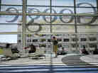 A Google logo is seen through windows of Moscone Center in San Francisco during Google's annual developer conference, Google I/O, in June. Google is one of several major tech companies known for the "acqui-hire."