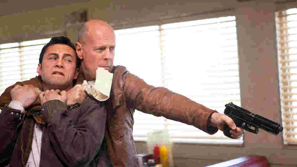 Joseph Gordon-Levitt and Bruce Willis star as present and future versions of the same man in Looper. Joseph Gordon-Levitt and Bruce Willis star as present and future versions of the same man in Looper.