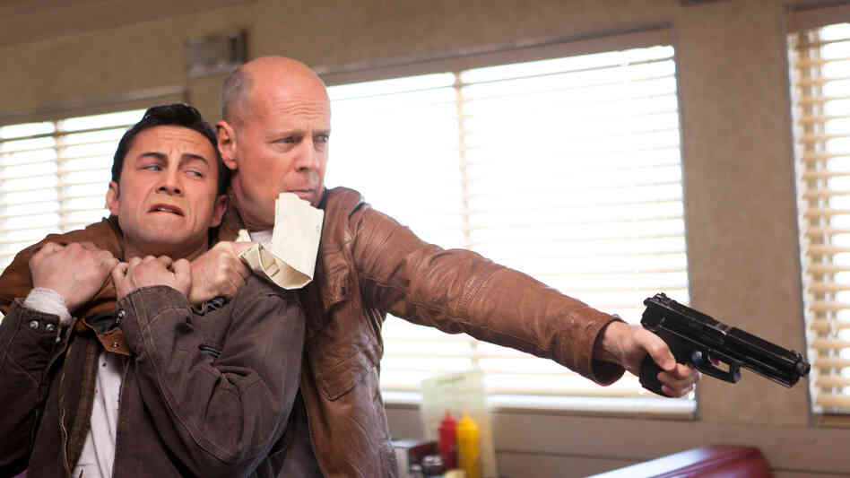 Joseph Gordon-Levitt and Bruce Willis star as present and future versions of the same man in Looper. Joseph Gordon-Levitt and Bruce Willis star as present and future versions of the same man in Looper.