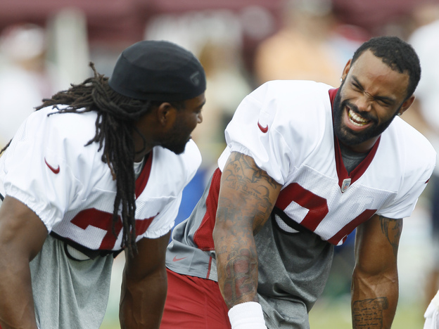 Niles Paul (right) at a Redskins practice with then-teammate Tim Hightower, before the juice-stealing incidents came to light.