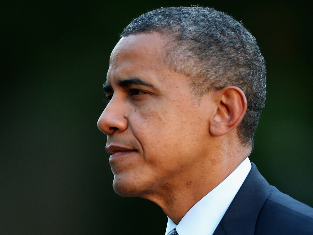 Barack Obama walks across the South Lawn after arriving at the White House September 13.