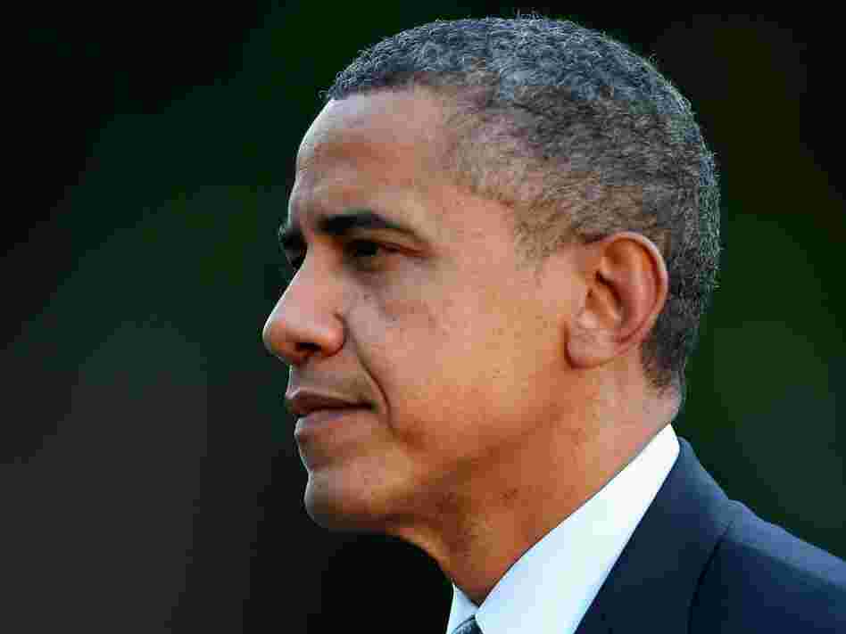 Barack Obama walks across the South Lawn after arriving at the White House September 13.