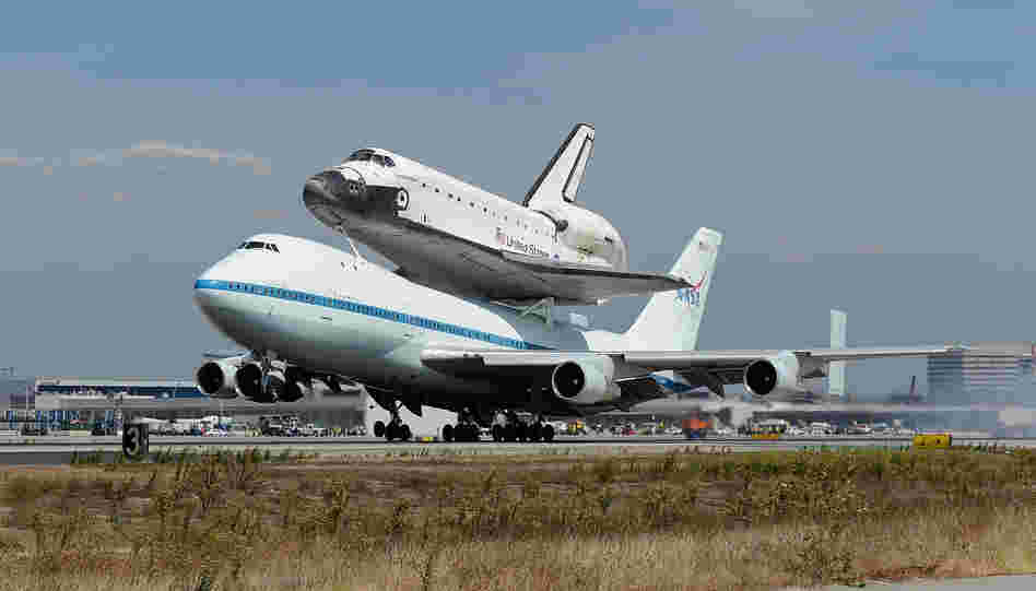 Space shuttle Endeavour and its Shuttle Carrier Aircraft land at Los Angeles International Airport.