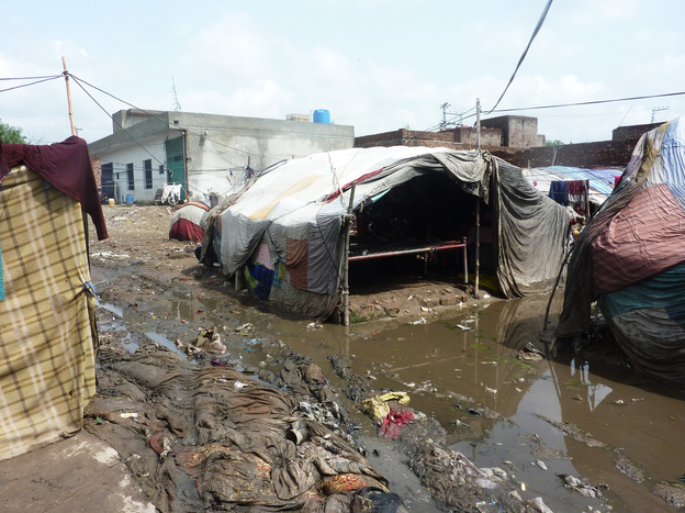 In an urban slum of Pakistan, the population is highly transient. People will raise a cloth tent one day, stay a little while and then move on.
