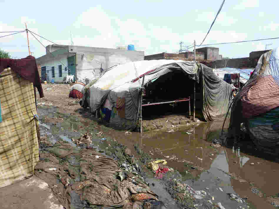 In an urban slum of Pakistan, the population is highly transient. People will raise a cloth tent one day, stay a little while and then move on.