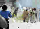 In Islamabad today, this demonstrator threw a tear gas canister back toward police.