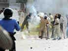 In Islamabad today, this demonstrator threw a tear gas canister back toward police.
