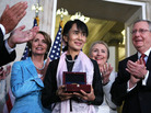 Burmese opposition politician Aung San Suu Kyi is presented with a U.S. Congressional Gold Medal at a ceremony at the rotunda of the U.S. Capitol on Wednesday in Washington, D.C. Burmese opposition politician Aung San Suu Kyi is presented with a U.S. Congressional Gold Medal at a ceremony at the rotunda of the U.S. Capitol on Wednesday in Washington, D.C.