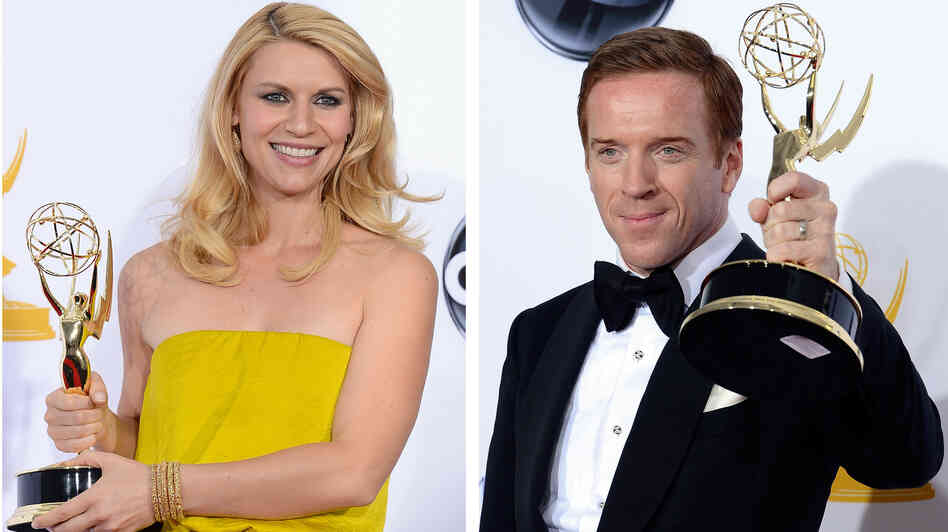 Claire Danes and Damian Lewis hold up their Emmy Awards for Showtime's Homeland.
