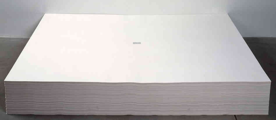 Felix Gonzalez-Torres' untitled 1991 work consists of a stack of papers, each with a tiny excerpt from The New York Times printed in the center. Visitors are invited to take a piece of paper from the work home with them. Felix Gonzalez-Torres' untitled 1991 work consists of a stack of papers, each with a tiny excerpt from The New York Times printed in the center. Visitors are invited to take a piece of paper from the work home with them.