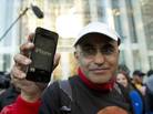 Hazem Sayed exits the Apple store on Fifth Avenue after purchasing his new iPhone 5. Hazem Sayed exits the Apple store on Fifth Avenue after purchasing his new iPhone 5.
