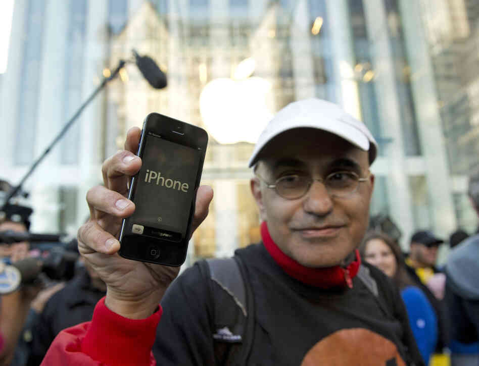Hazem Sayed exits the Apple store on Fifth Avenue after purchasing his new iPhone 5.
