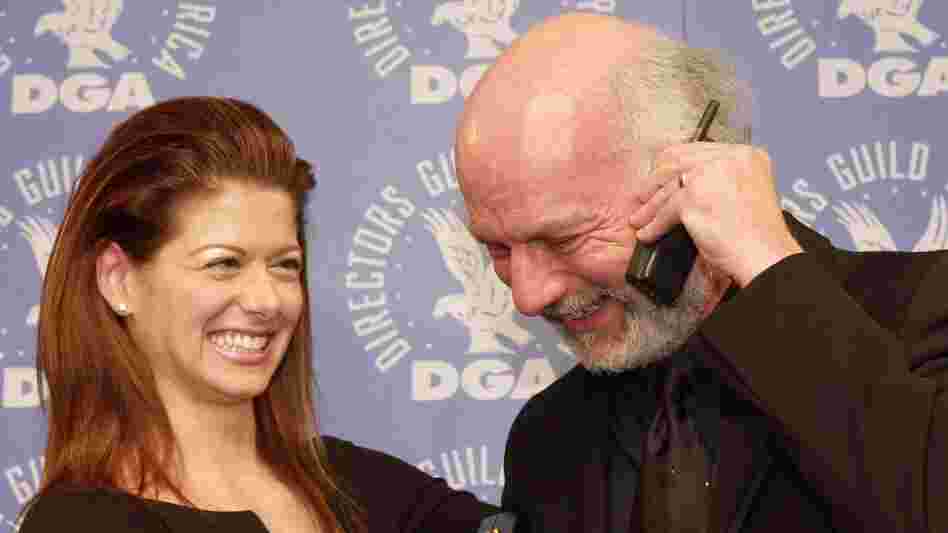 In a 2001 photo, actress Debra Messing and director James Burrows pose together after Burrows won a Directors Guild of America award for directing the pilot of Will & Grace.